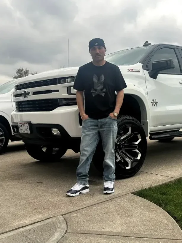 The Mendoza Rodriguez crew standing by their white work truck in Lorain, Ohio