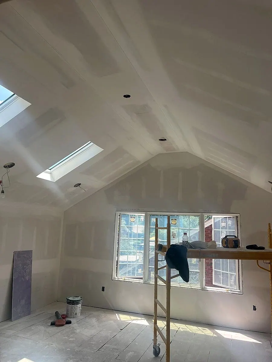 Cathedral drywall ceiling with skylight, taped and finished in Lorain, Ohio