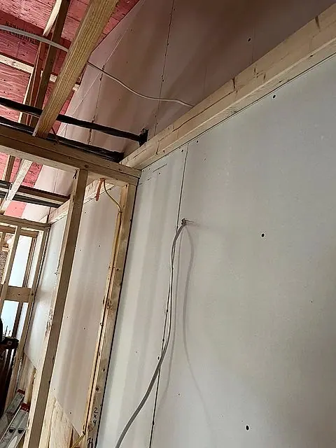 Corner framing with new drywall going up in Lorain, Ohio