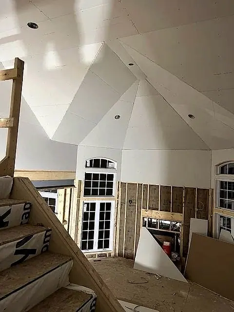 Cathedral ceiling and arched window mid-finish in Lorain, Ohio
