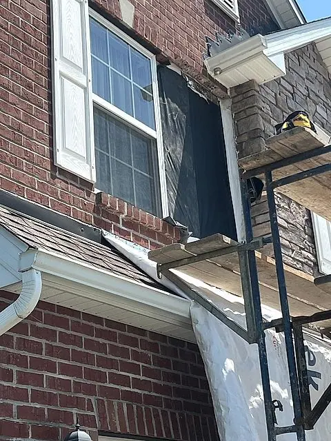 Scaffold set at the eaves for a roof repair in Lorain, Ohio