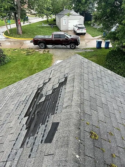 Roof patch in progress on a shingle roof in Lorain, Ohio