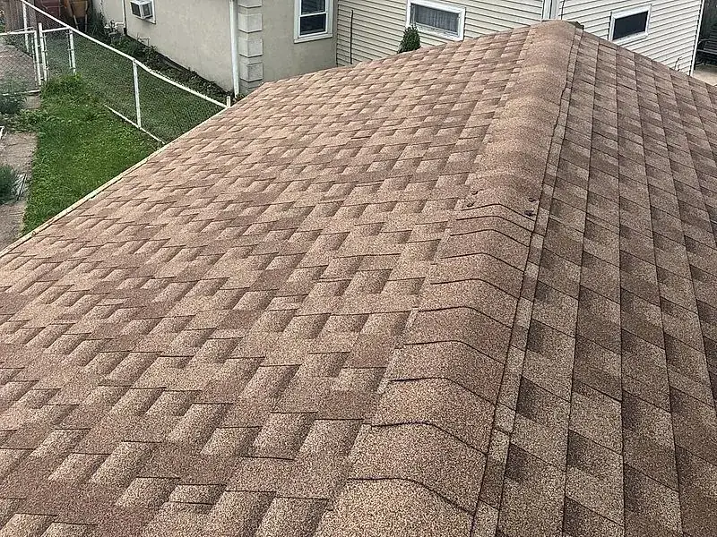 New architectural shingle roof installed by Mendoza Rodriguez, crisp overlapping rows